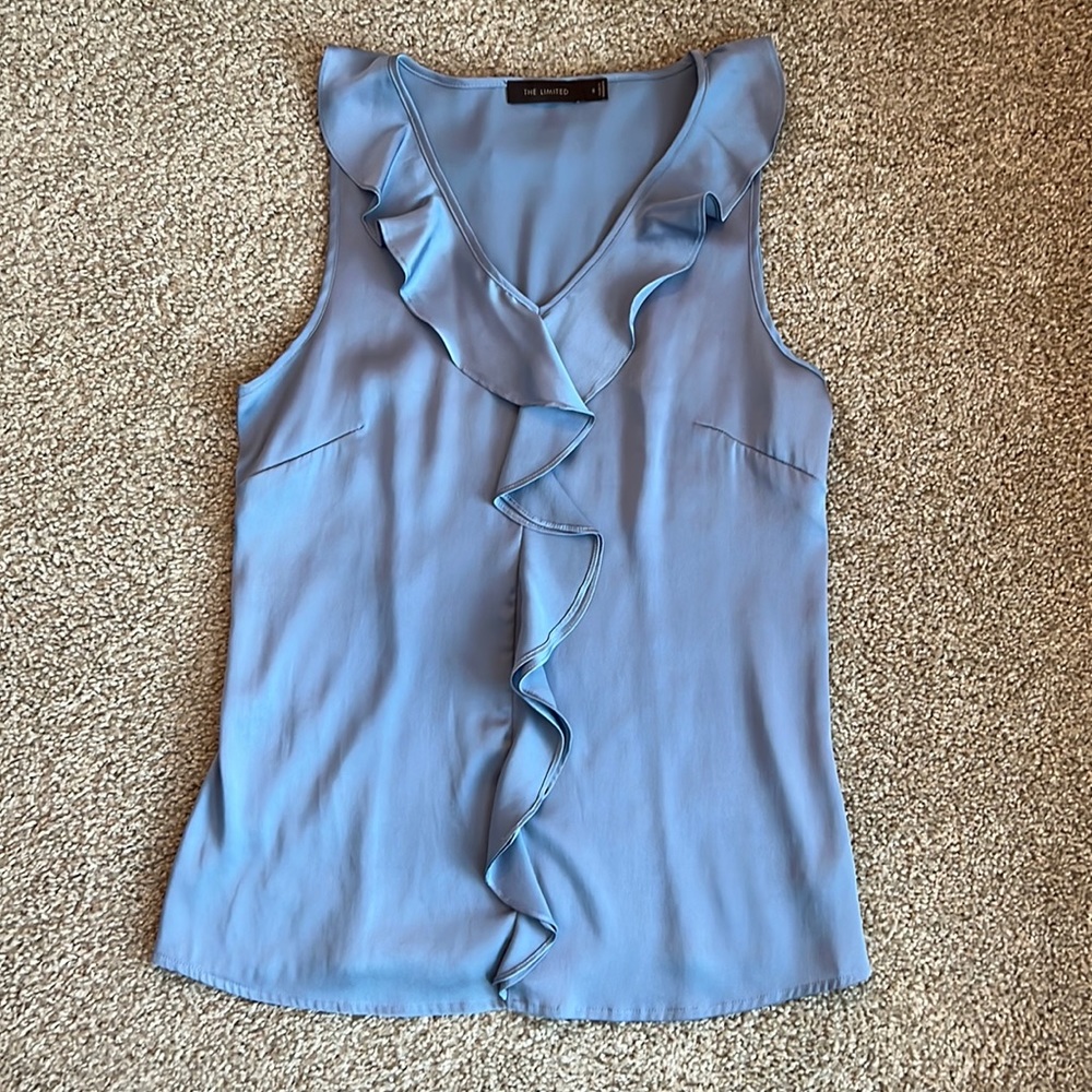 The limited blue silk ruffle blouse